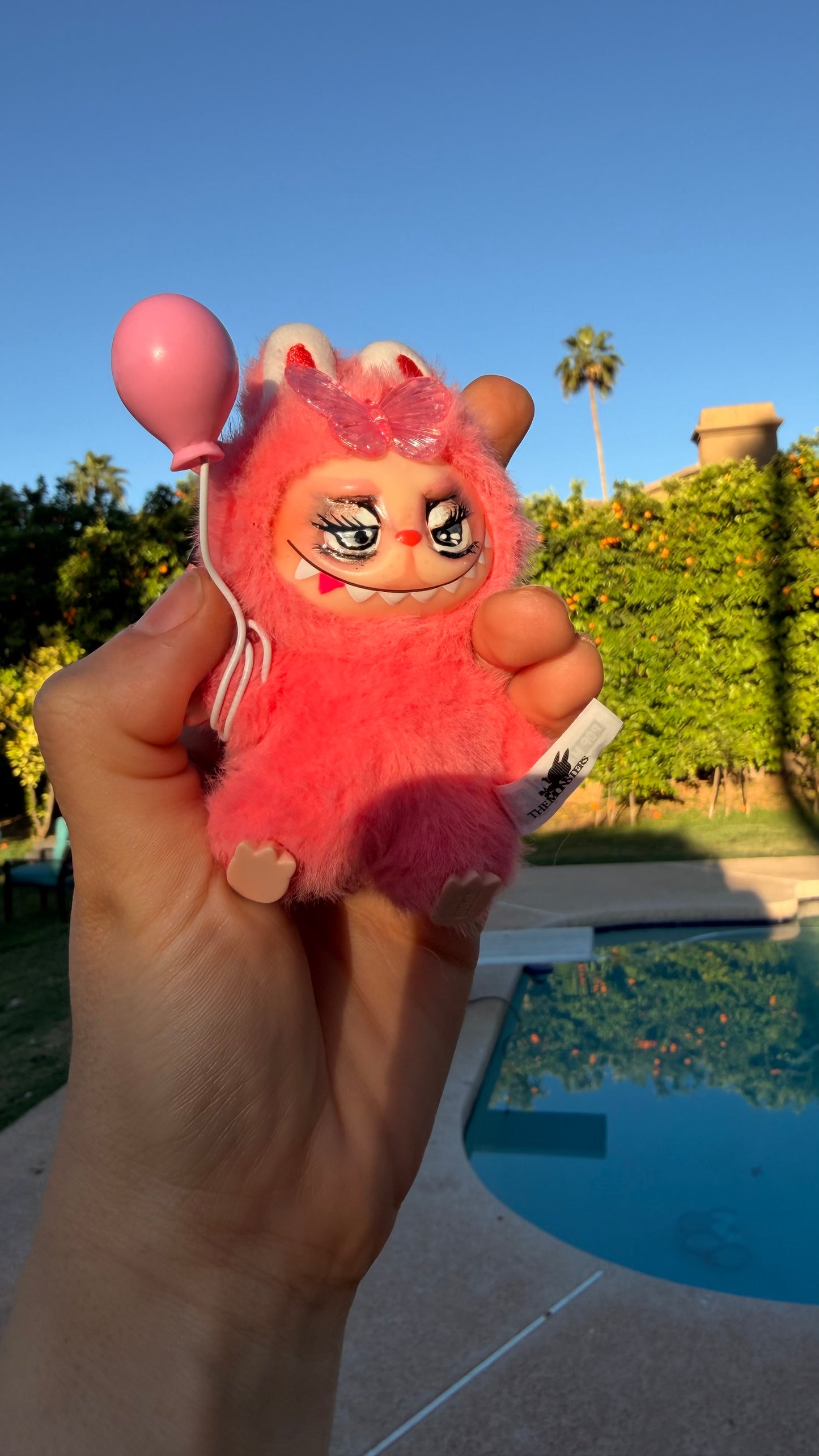 Pink Furry Toy with Balloon