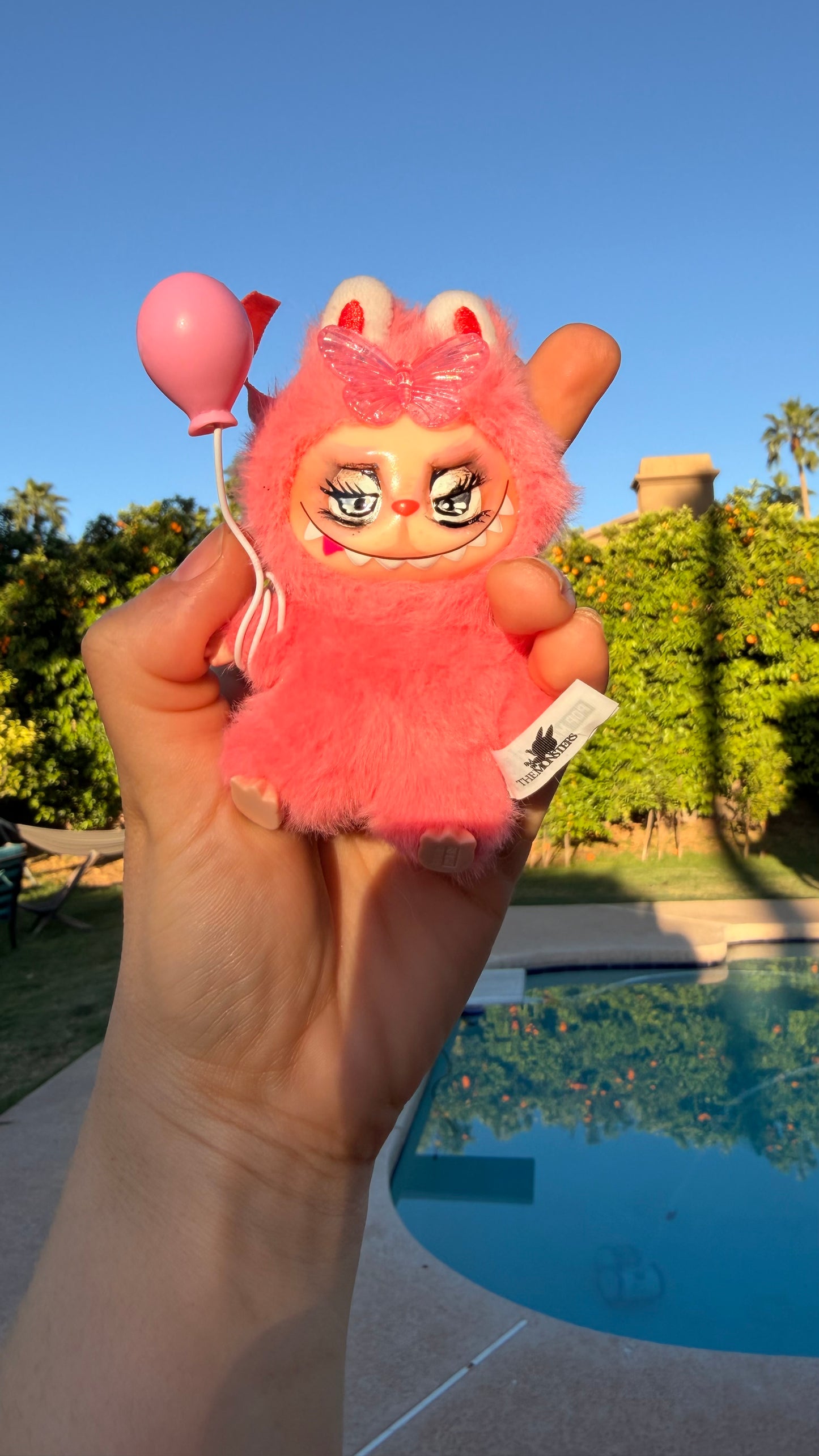 Pink Furry Toy with Balloon